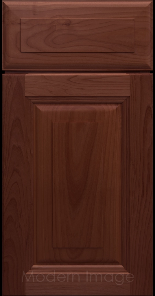 Durango raised panel cabinet door in a Cherry stain featuring a stepped molded frame.